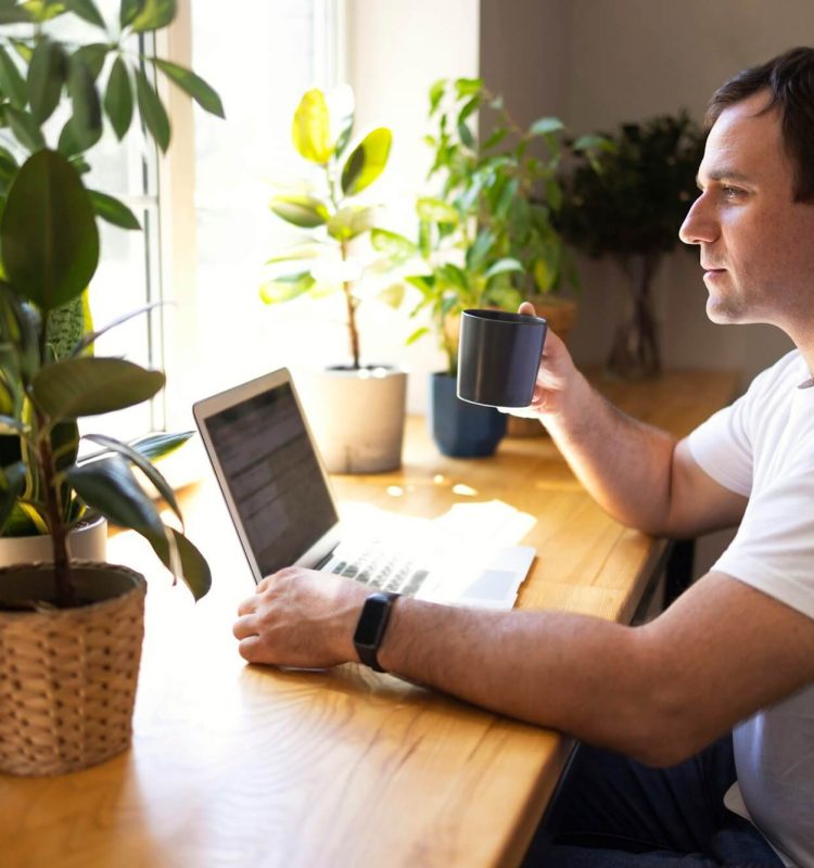 young-personal-development-coach-answering-the-client-by-email-by-a-laptop-2